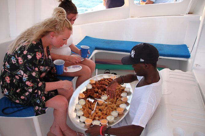 3 hour Glow Worm Sunset Cruise from Providenciales - On board in Providenciales: power vs. sail catamaran vibes