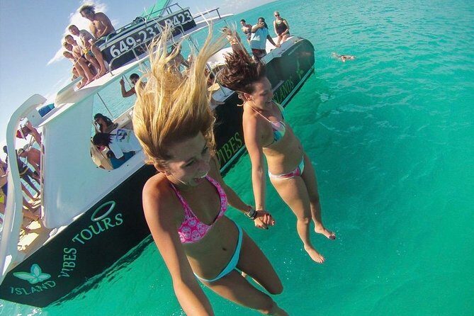 4hour Group Half Day Snorkeling Excursion in Grace Bay - Back Toward Grace Bay: Slides and a Rooftop Jump Platform