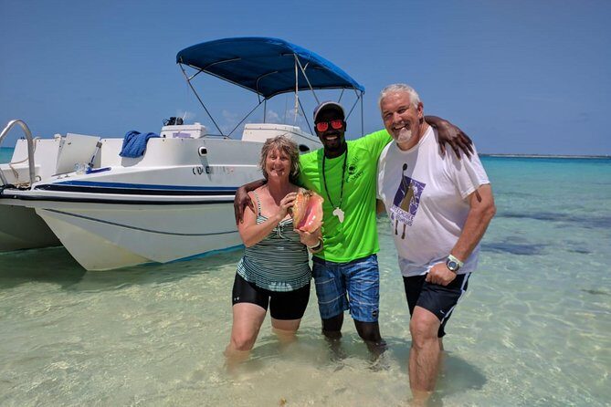 Gibbs Cay Stingray and Conch Dive Adventure - Swimming with southern stingrays in shallow water