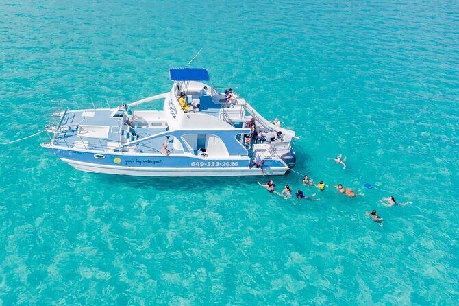 Private 7-Hour Catamaran Tour in Turks and Caicos - Grace Bay Beach Stop and the Soviet Shipwreck Photo Moment